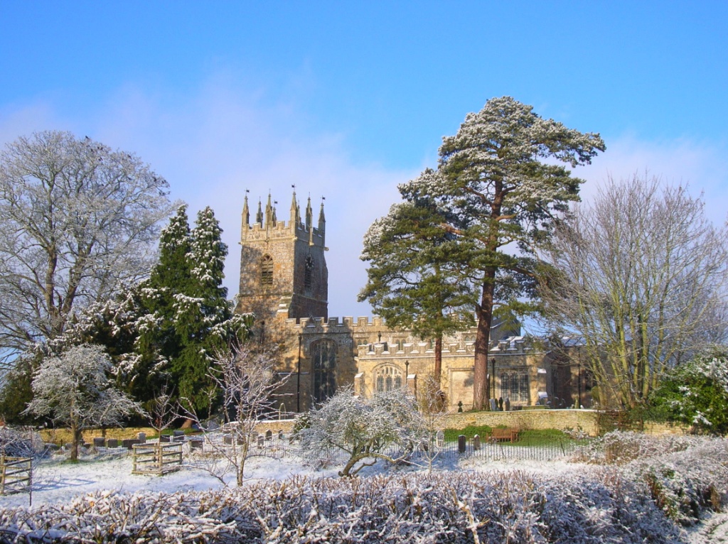 St James's church tower seen across snowy gardens